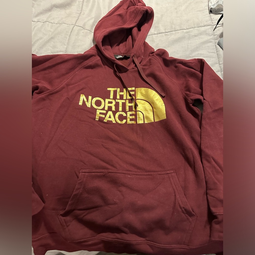 2 The North Face woman’s Hoodies 1 navy blue 1 maroon both have metallic logo